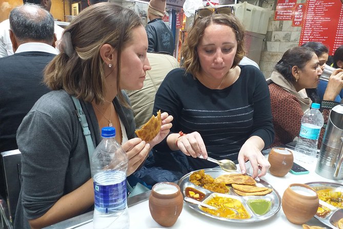 Chandni Chowk Old Delhi Food Tour with Spice Market - Digambar Jain Lal Mandir and Gurudwara Sis Ganj Sahib, where the tour slows down