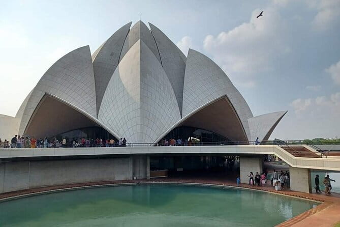 Explore Delhi Half-Day Tour with Agra Drop - Old Delhi First: Red Fort and Chandni Chowk street life